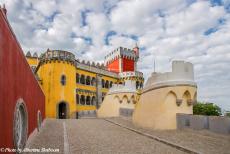 Portugal - Classic Car Road Trip Portugal: The Pena National Palace, built on the ruins of a monastery. King Ferdinand II of Portugal transformed a...