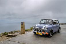 Portugal, IMM Praia de Mira - Classic Car Road Trip from the Netherlands to Portugal: Our iconic Classic Mini Authi next to the zero-kilometre&nbsp;signpost of the...