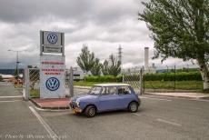 Portugal, IMM Praia de Mira - Classic Car Road Trip: Our Classic Mini at the gates of her birthplace, the former factory of the Authi Car Company in Pamplona&nbsp;(Automoviles...