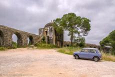 Portugal, IMM Praia de Mira - Classic Car Road Trip from the Netherlands to Portugal: Our Mini Authi in front of the inspection building of the Peg&otilde;es Aqueduct, the...