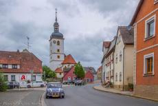 Germany, IMM Geiselwind - IMM Geiselwind: Our own&nbsp;Mini Authi in front of the Pfarrkirche St. Burkhard in Geiselwind. The church dates back to the Middle Ages, with its...