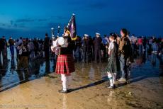 Normandy, 70 years after D-Day - Commemorating D-Day in Normandy: A Scottish bagpiper on Juno Beach in front of the Canada House in Bernières-sur-Mer during the... Normandy, 70 years after D-Day - Commemorating D-Day in Normandy: A Scottish bagpiper on Juno Beach in front of the Canada House in Bernières-sur-Mer during the...