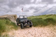 Normandy, 70 years after D-Day - Memorial tour along the Normandy landing beaches: Our own WWII Ford Jeep on Juno Beach, with a German bunker of the Atlantic Wall in the... Normandy, 70 years after D-Day - Memorial tour along the Normandy landing beaches: Our own WWII Ford Jeep on Juno Beach, with a German bunker of the Atlantic Wall in the...