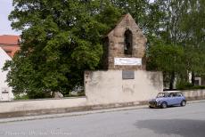 Poland, IMM Leszno - Here, our Classic Mini Authi is parked in front of the bell monument in Herrnhut. This historic monument stands on the remaining wall of the... Poland, IMM Leszno - Here, our Classic Mini Authi is parked in front of the bell monument in Herrnhut. This historic monument stands on the remaining wall of the...
