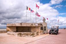 Normandy, 65 years after D-Day - Commemorating D-Day, the 65th anniversary: Our own RAF-blue Jeep next to a WWII German bunker on Juno Beach in Bernières-sur-Mer. It was... Normandy, 65 years after D-Day - Commemorating D-Day, the 65th anniversary: Our own RAF-blue Jeep next to a WWII German bunker on Juno Beach in Bernières-sur-Mer. It was...