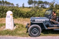 Normandy, 65 years after D-Day - Classic Car Road Trip Normandy 2009: Our RAF blue Ford Jeep next to a milestone along the Liberty Road (French: La Voie de la... Normandy, 65 years after D-Day - Classic Car Road Trip Normandy 2009: Our RAF blue Ford Jeep next to a milestone along the Liberty Road (French: La Voie de la...