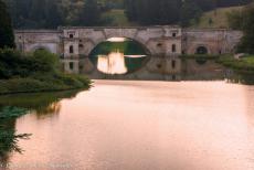 Longbridge IMM - Classic Car Road Trip in a Mini Monza: The Queen's Pool and the Grand Bridge at Blenheim Palace, the water from the Queen's Pool flows...
